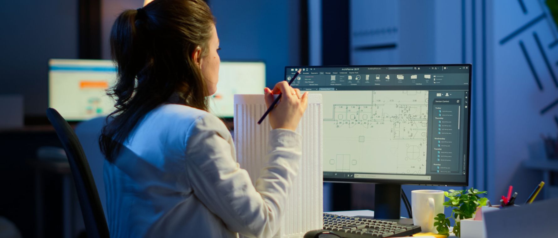 Engineer constructor designer architect creating new component in CAD program working in business office. Industrial woman employee studying prototype idea showing cad software on device display